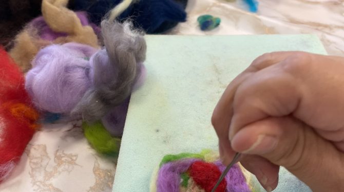 Client doing felting at a new art group