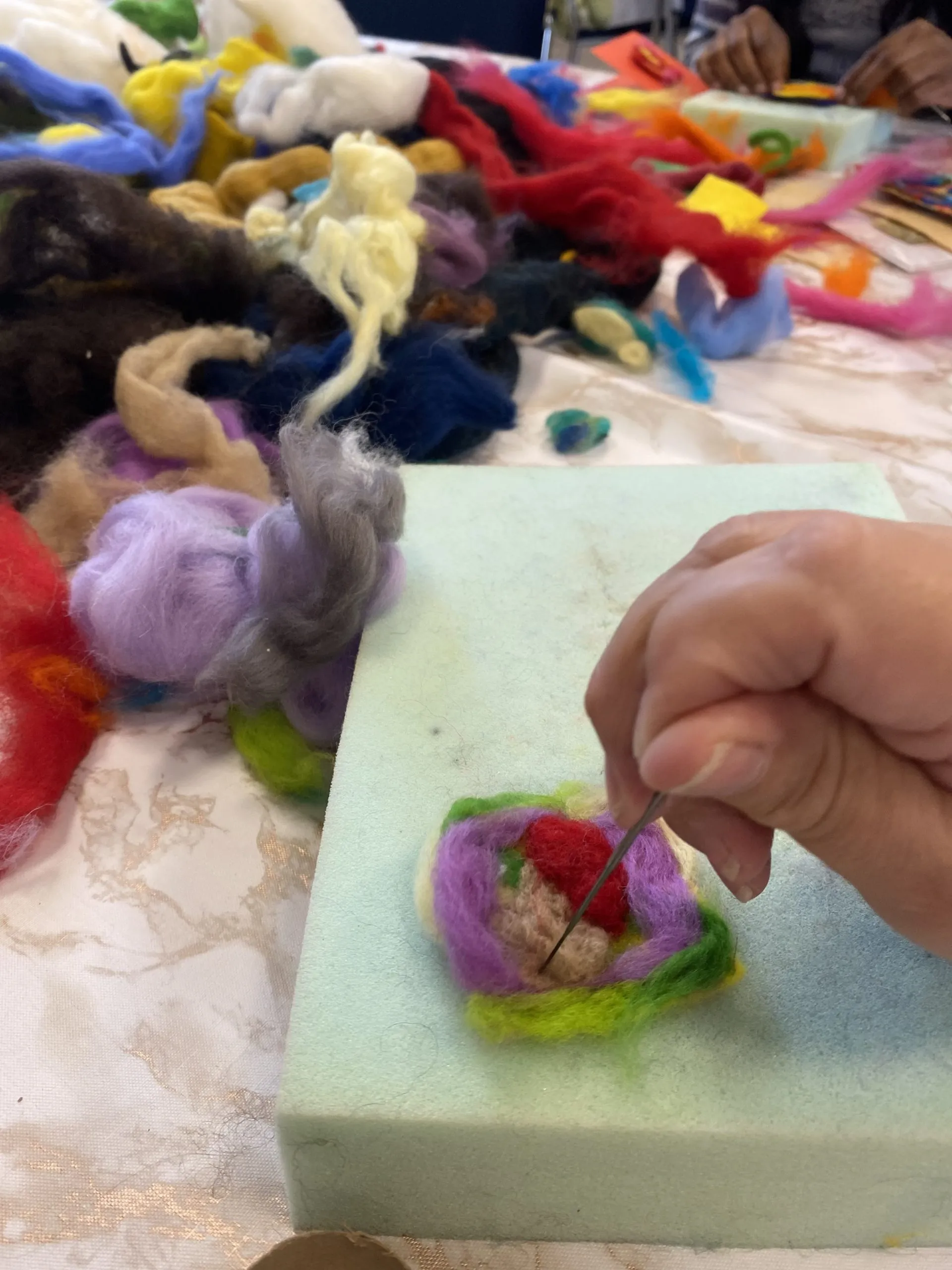 Client doing felting at a new art group