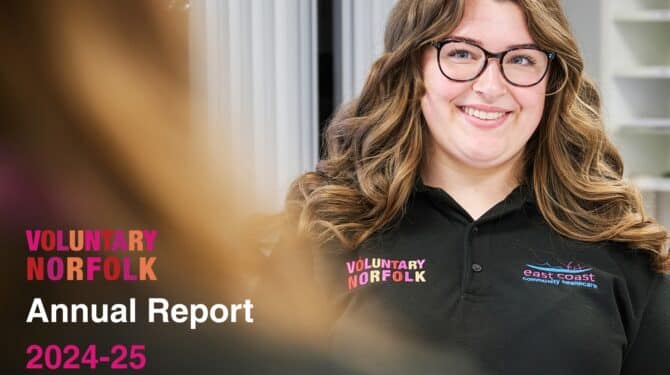 Voluntary Norfolk annual report cover photo depicting a smiling volunteer wearing a black polo shirt with Voluntary Norfolk and ECCH logos
