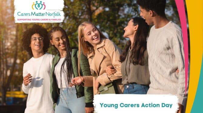 Group of young people smiling. The text on the photo says 'Young Carers Action Day'.